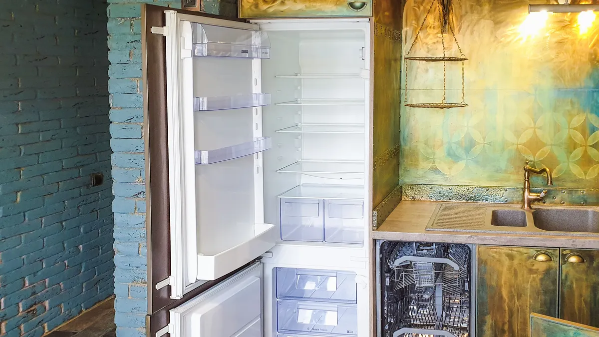 Standalone refrigerator in a kitchen, illustrating safe fridge disposal in Dubai with refrigerant recovery and metal recycling