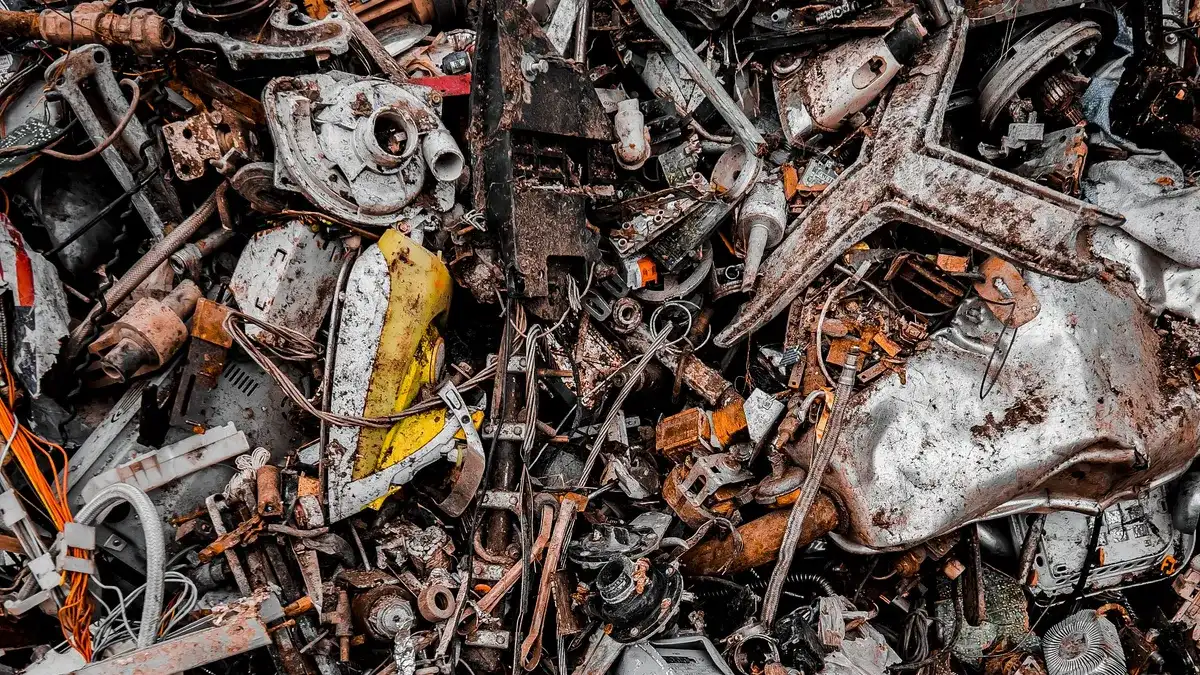 Pile of scrap metal and appliance parts at a recycling yard, illustrating responsible metal and e-waste recycling in Dubai