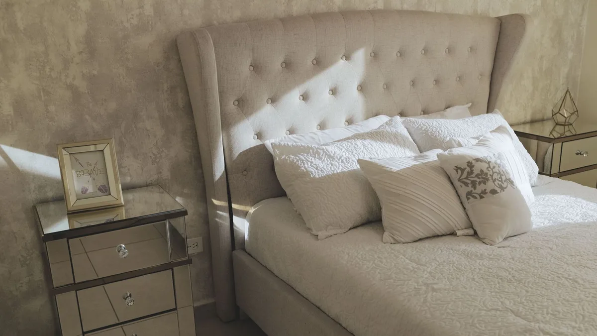 Premium upholstered bed in a Dubai apartment bedroom ready for bed collection and clearance