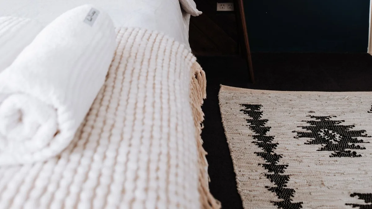 Wooden headboard and bed being measured before headboard and bed collection in a Dubai apartment