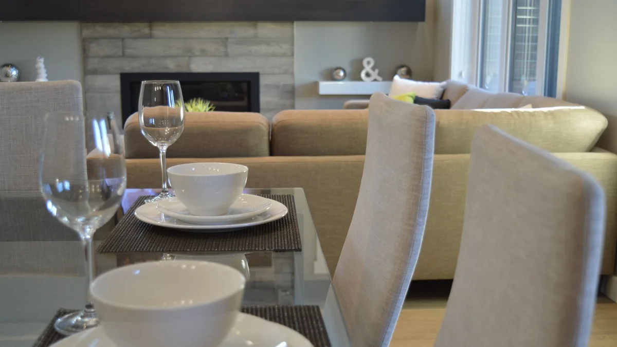 Glass-topped dining table with chairs in a modern Dubai living space, representing safe glass dining table removal