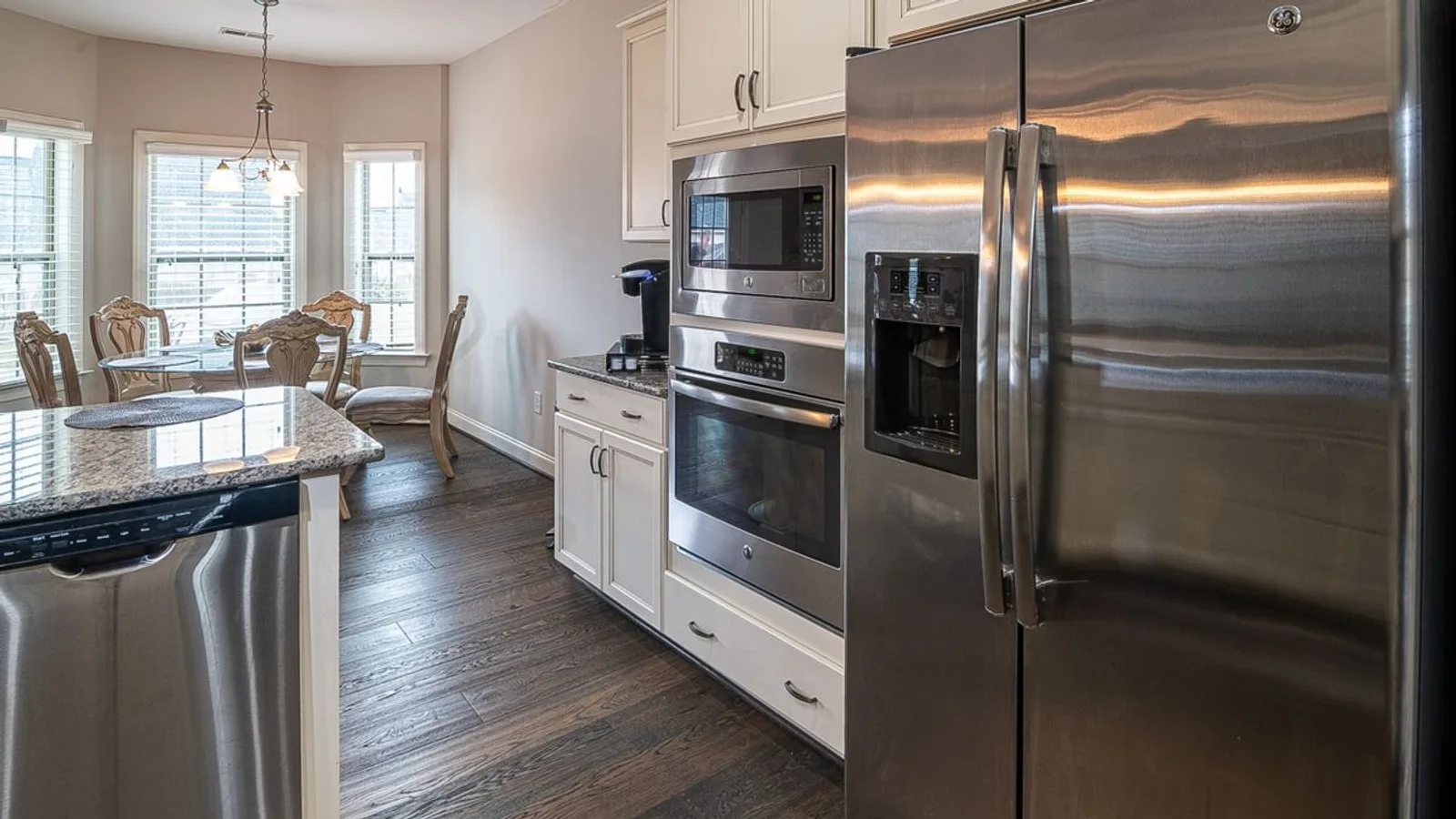 Modern Dubai kitchen fitted with a stainless-steel fridge, oven and dishwasher ready for household appliance pickup