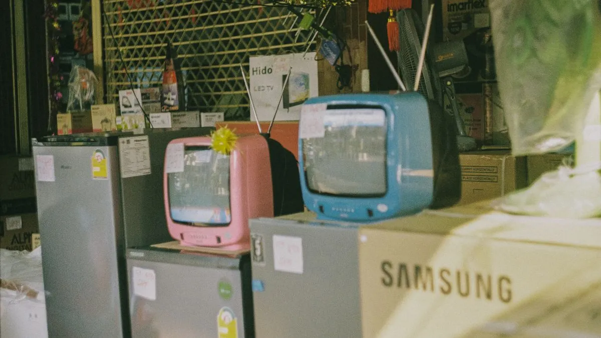 Old refrigerators, fans and retro televisions gathered for reuse and recycling after appliance pickup in Dubai