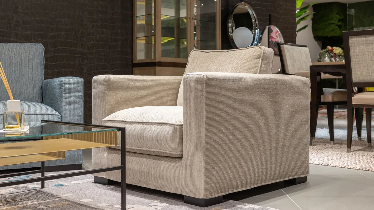 Good-condition beige armchair in a stylish living room, suitable for donation or resale in Dubai