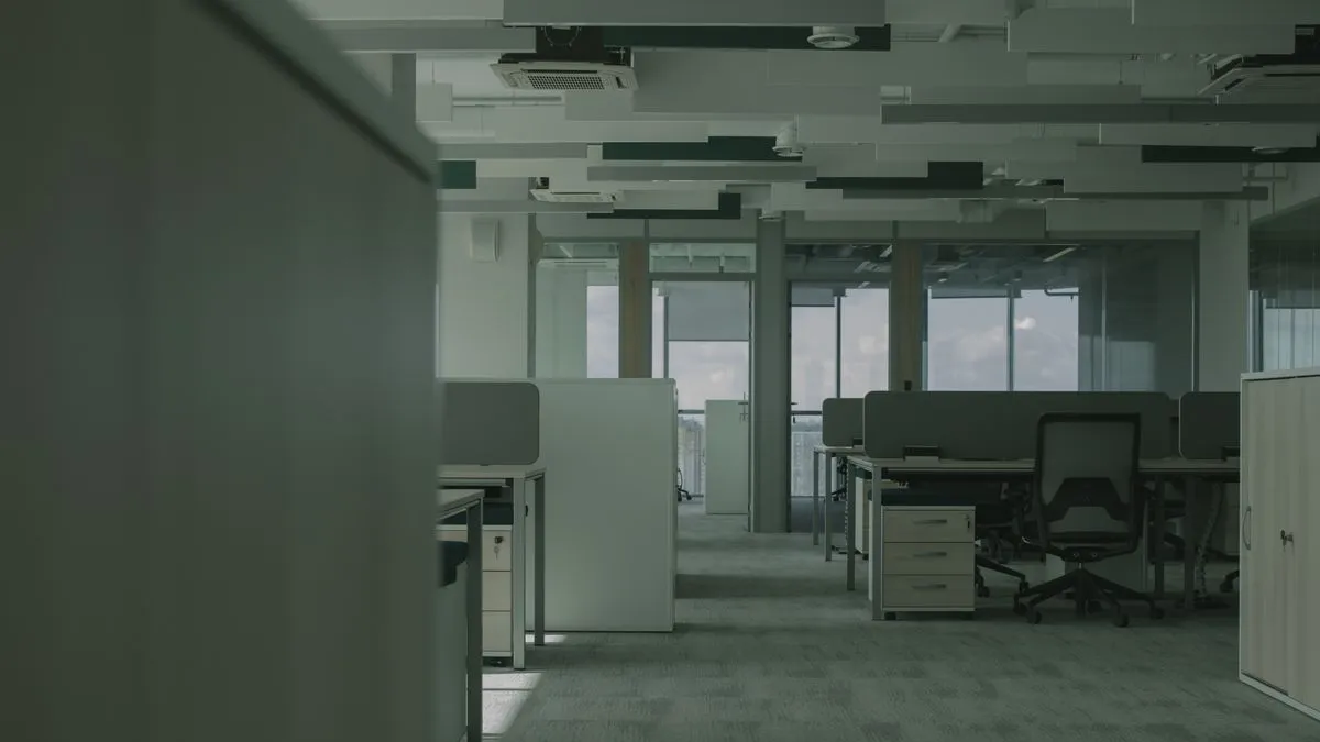 Rows of office desks, partitions and mobile pedestals in a Dubai office ready for office desk and workstation removal