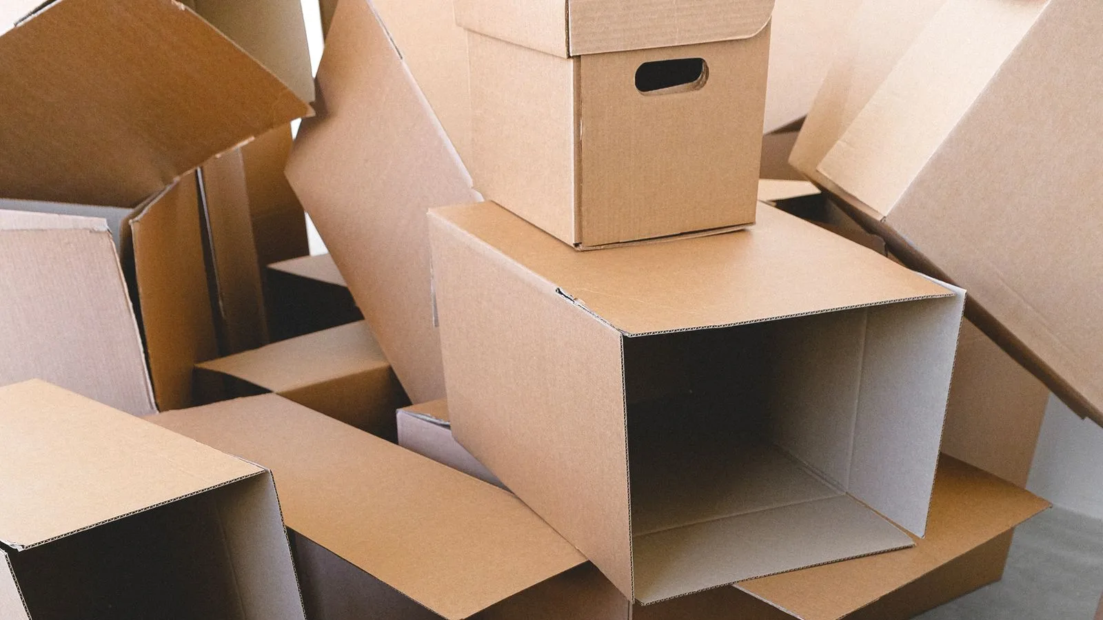 Archive and moving boxes stacked for an office junk removal and cleanout in Dubai