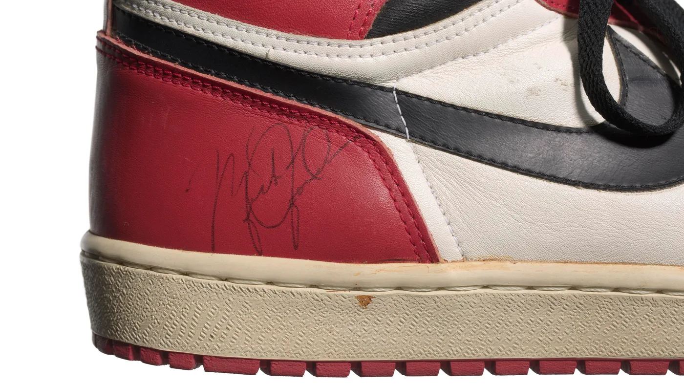 Close up view of the rubber outsole and synthetic midsole layers on athletic sneakers