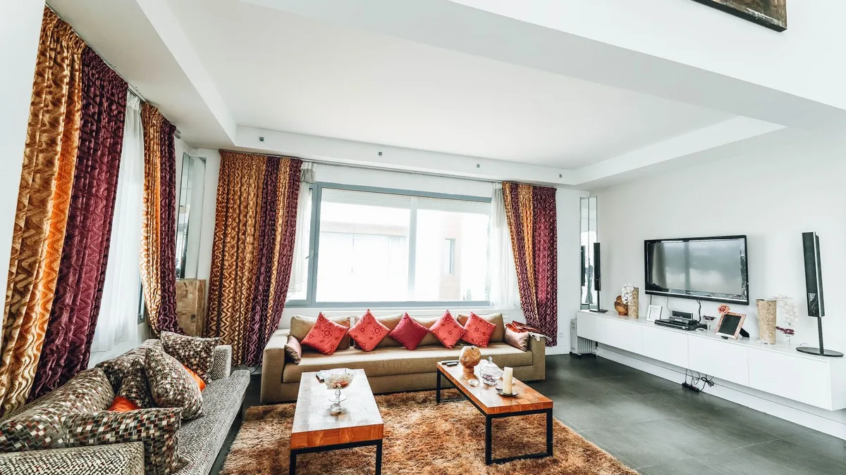 Large sectional sofa and couch in a spacious Dubai villa living room prepared for sectional sofa pickup