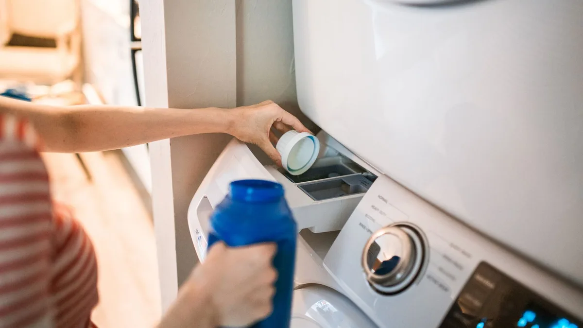 Home laundry area in a Dubai apartment with a front-load washing machine ready for appliance collection